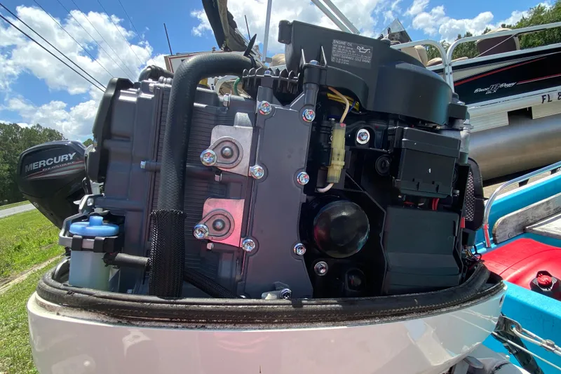 Slide: The Image of Close-up of a Mercury outboard motor on a 1959 Boston Whaler 13 boat. - 13