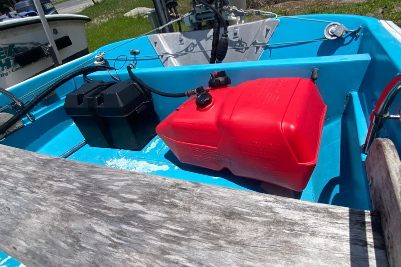 Slide: The Image of Interior of a 1959 Boston Whaler 13 boat with red fuel tank and battery. - 7