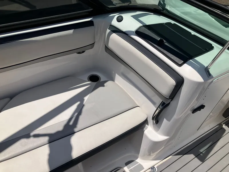 Slide: The Image of Interior of a 2016 Yamaha Boats 212X with white upholstery. - 11