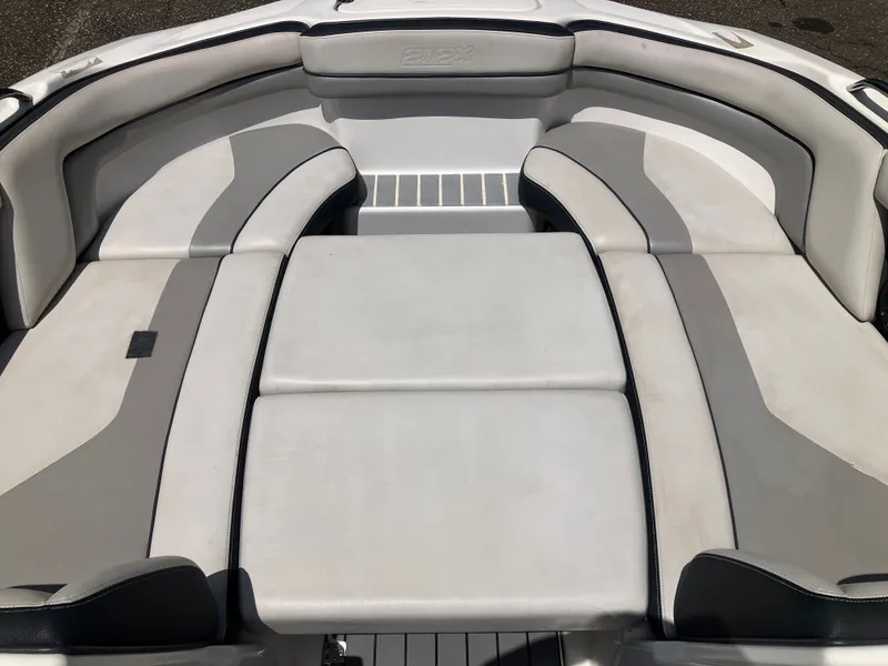 Slide: The Image of Interior of a 2016 Yamaha Boats 212X with gray upholstery. - 15