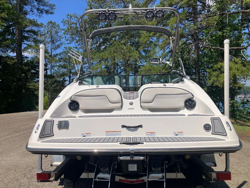 Slide: The Image of Rear view of a 2016 Yamaha Boats 212X on a trailer. - 6