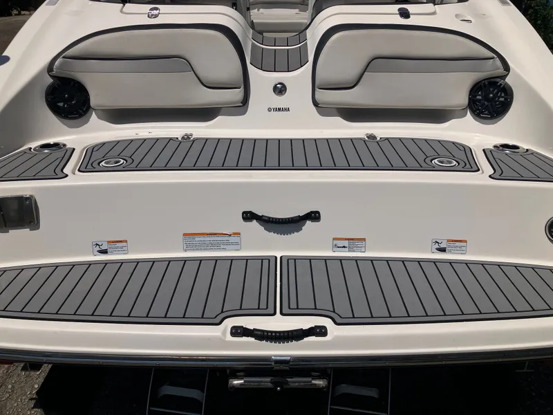 Slide: The Image of Rear view of a 2016 Yamaha Boats 212X with gray upholstery. - 7