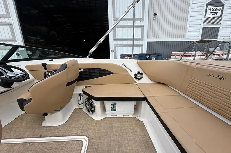 Slide: The Image of Interior of 2021 Sea Ray SPX 210 boat with tan seating and modern design. - 11