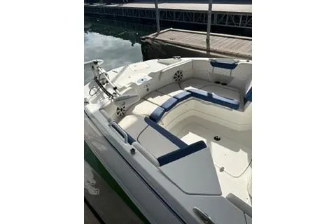 Slide: The Image of 2020 Tahoe 2150 CC boat with spacious seating at a dock. - 5