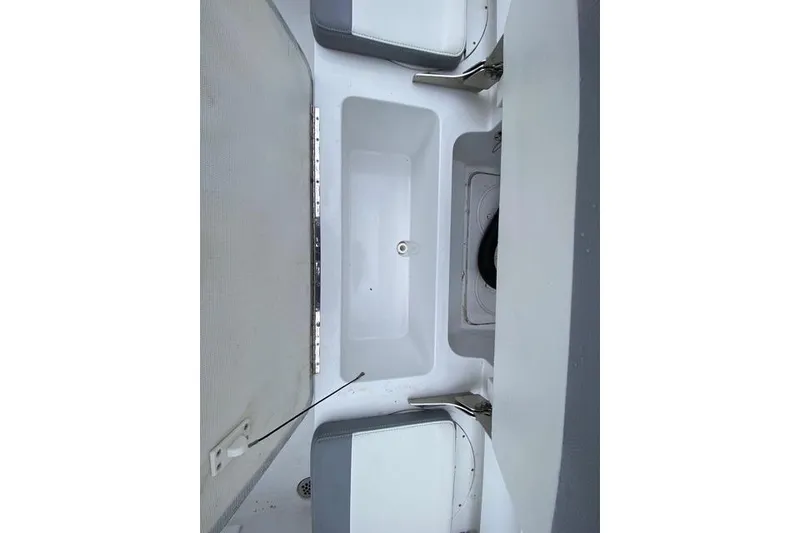 Slide: The Image of Interior view of a 2021 Release 210 RX boat storage compartment. - 15