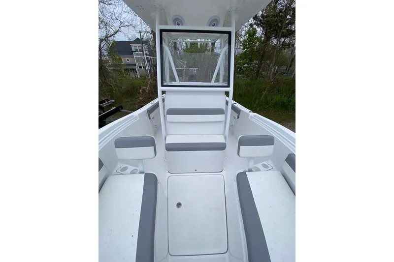 Slide: The Image of Interior view of a 2021 Release 210 RX boat, featuring seating and storage compartments. - 16