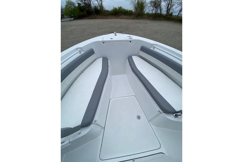 Slide: The Image of Interior view of a 2021 Release 210 RX boat with gray seating. - 17
