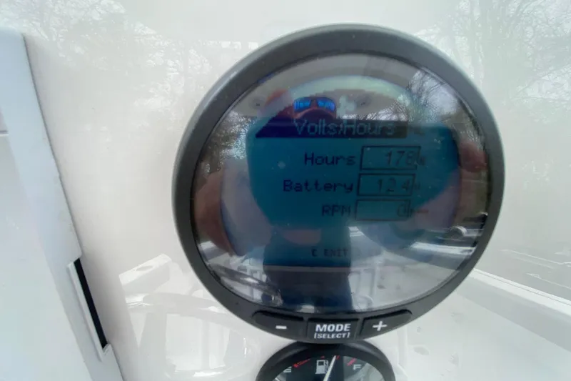 Slide: The Image of Digital display showing hours, battery voltage, and RPM on a 2021 Release 210 RX. - 20