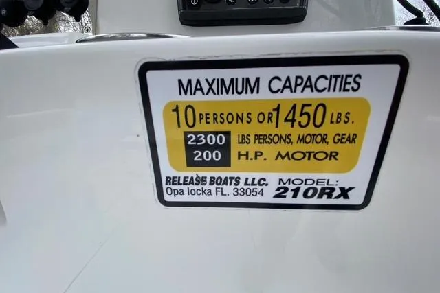 Slide: The Image of Release 210 RX 2021 boat capacity label: 10 persons or 1450 lbs, 200 HP motor. - 21