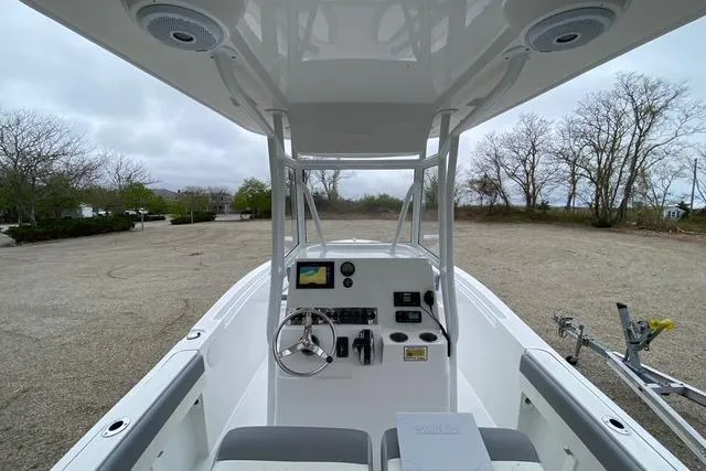 Slide: The Image of 2021 Release 210 RX boat console with steering wheel and navigation system. - 9