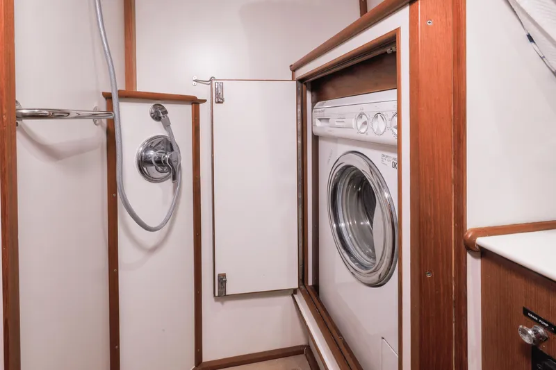 Slide: The Image of Laundry area with washer in 2002 Grand Banks 46 Europa yacht bathroom. - 16