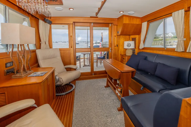 Slide: The Image of Luxurious interior of 2002 Grand Banks 46 Europa yacht with elegant wood finish and comfortable seating. - 27
