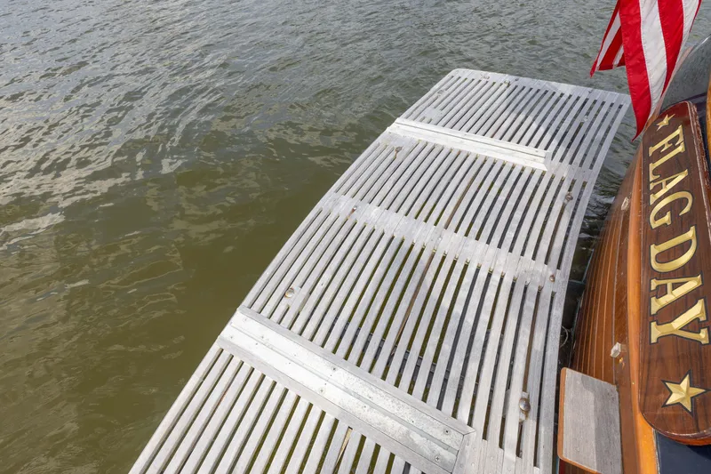 Slide: The Image of Grand Banks 46 Europa 2002 yacht stern with swim platform and American flag. - 33