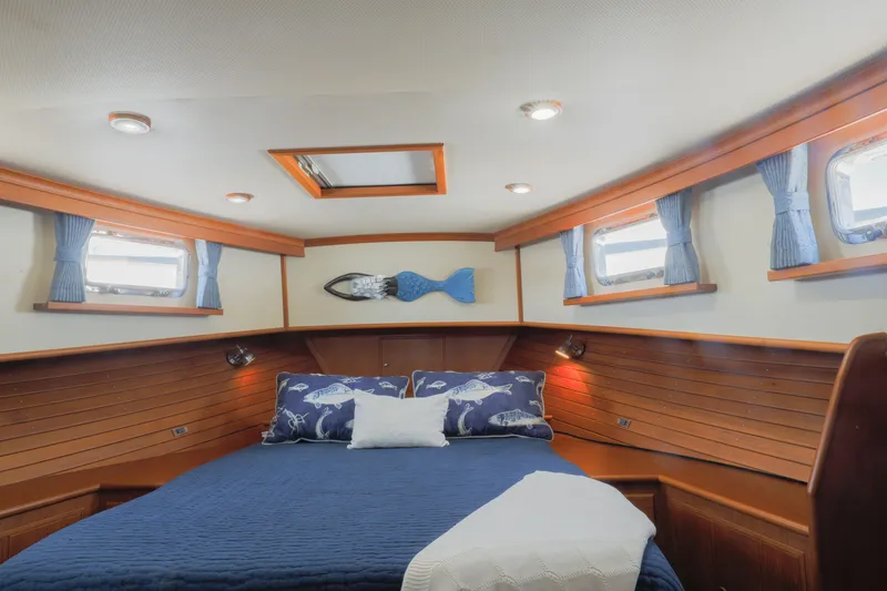 Slide: The Image of Cozy cabin interior of 2002 Grand Banks 46 Europa yacht with nautical decor. - 5