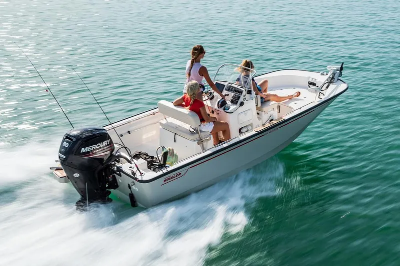 Slide: The Image of Manufacturer Provided Image: 2026 Boston Whaler 170 Montauk boat cruising on clear water with passengers. - 2