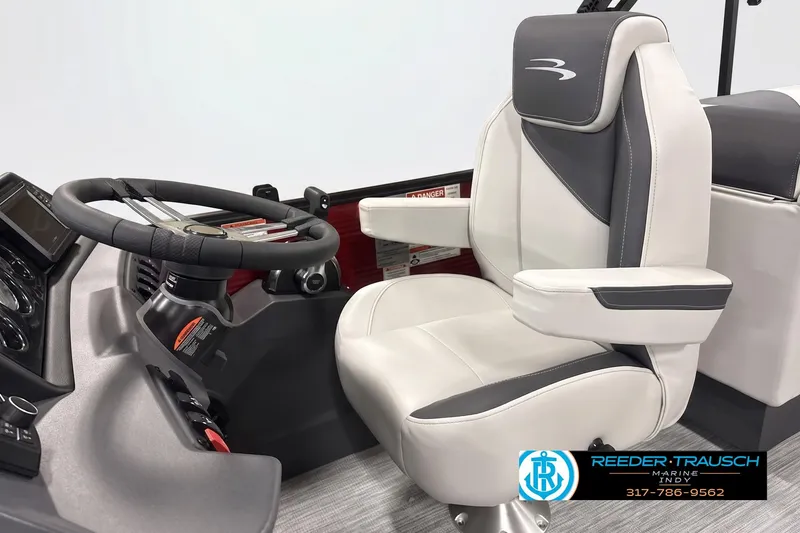Slide: The Image of Captain's chair and steering wheel of 2026 Bennington 22 S1SR boat, featuring modern design. - 3