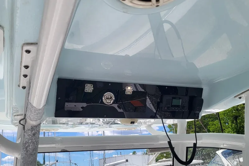 Slide: The Image of 2020 Sportsman Open 282 Center Console boat interior with mounted radio and speaker system. - 10