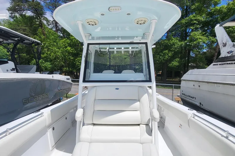 Slide: The Image of 2020 Sportsman Open 282 Center Console boat with white seating and canopy. - 13