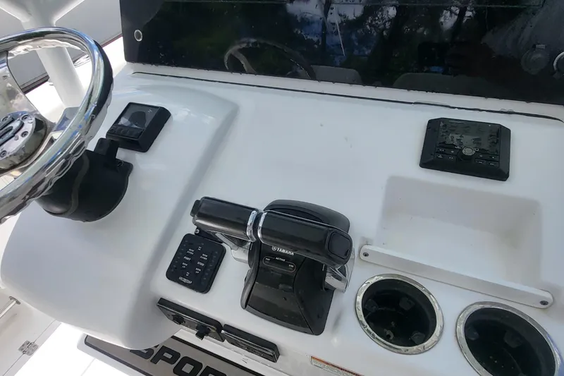 Slide: The Image of 2020 Sportsman Open 282 Center Console dashboard with steering wheel and controls. - 5