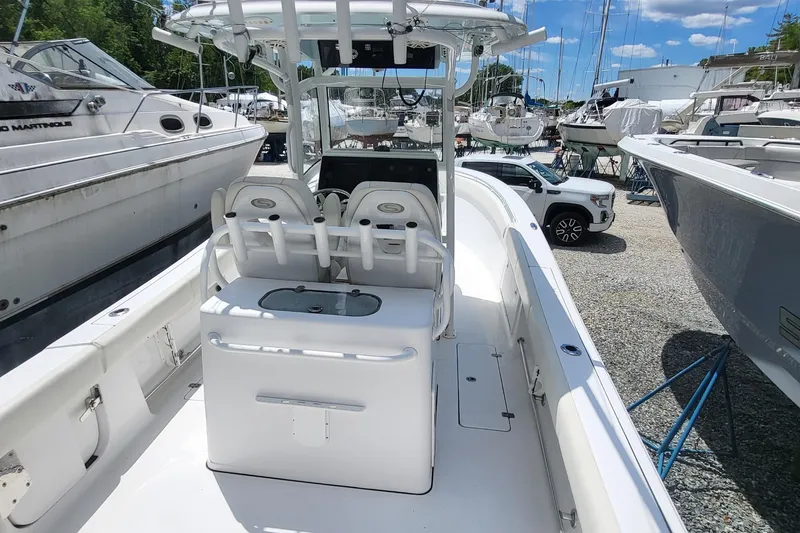 Slide: The Image of 2020 Sportsman Open 282 Center Console boat in marina, surrounded by other vessels. - 8