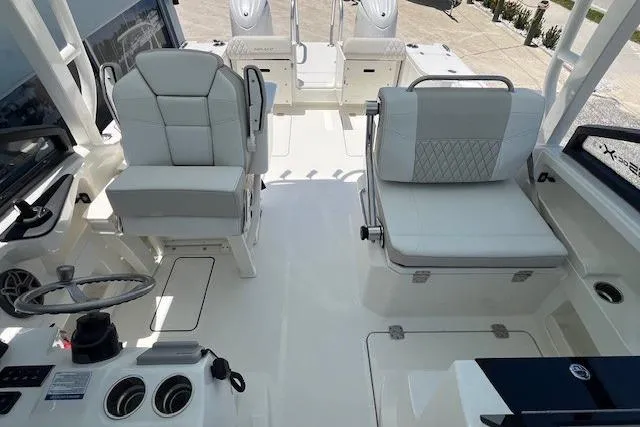 Slide: The Image of 2026 World Cat 265 DC-X boat interior with modern seating and steering console. - 5