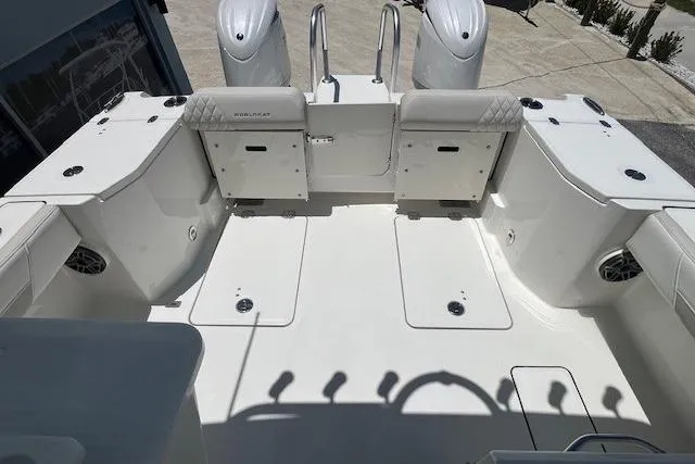Slide: The Image of 2026 World Cat 265 DC-X boat deck with dual engines and seating area. - 6