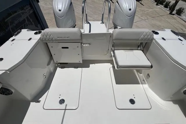 Slide: The Image of 2026 World Cat 265 DC-X boat interior with dual engines and seating area. - 7