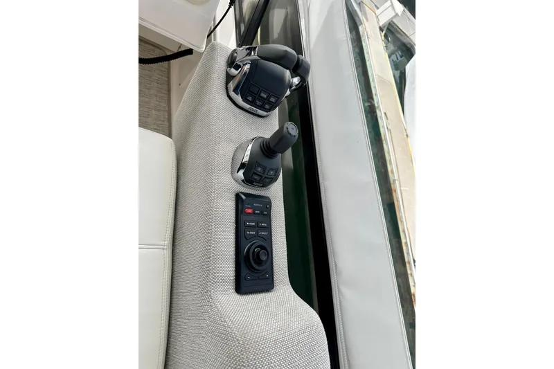 Slide: The Image of Control panel of 2019 Tiara Yachts F44 Flybridge with joystick and throttle. - 30