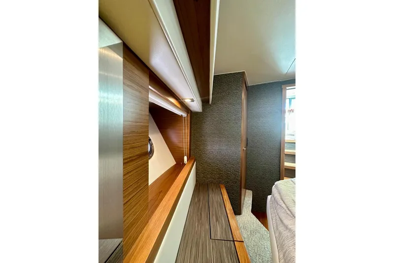 Slide: The Image of Interior of 2019 Tiara Yachts F44 Flybridge, featuring sleek wood finishes and modern design. - 36
