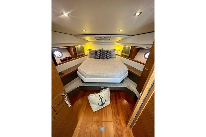 Slide: The Image of Luxurious cabin interior of 2019 Tiara Yachts F44 Flybridge with elegant bedding. - 38
