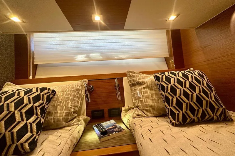 Slide: The Image of Luxurious cabin interior of 2019 Tiara Yachts F44 Flybridge with stylish bedding. - 49