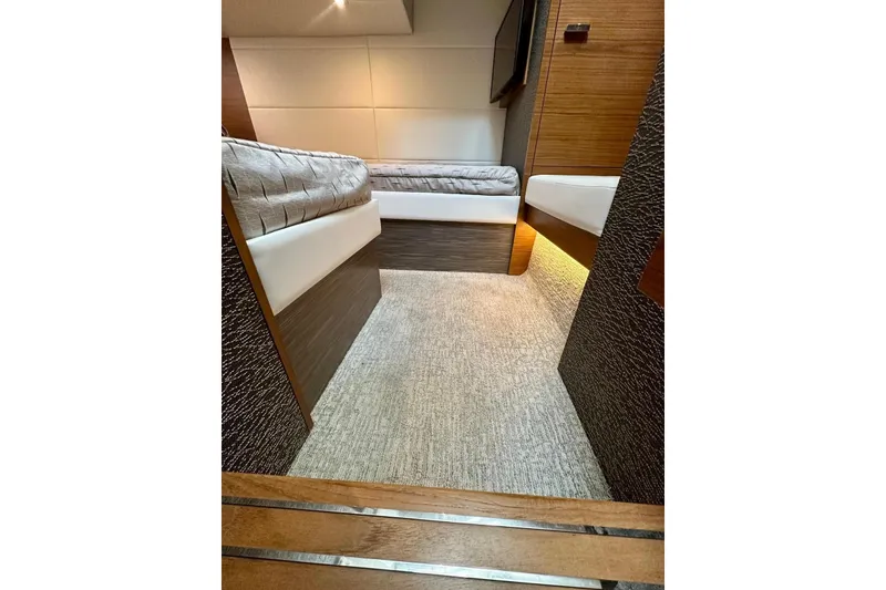 Slide: The Image of 2019 Tiara Yachts F44 Flybridge cabin interior with twin beds and modern design. - 53