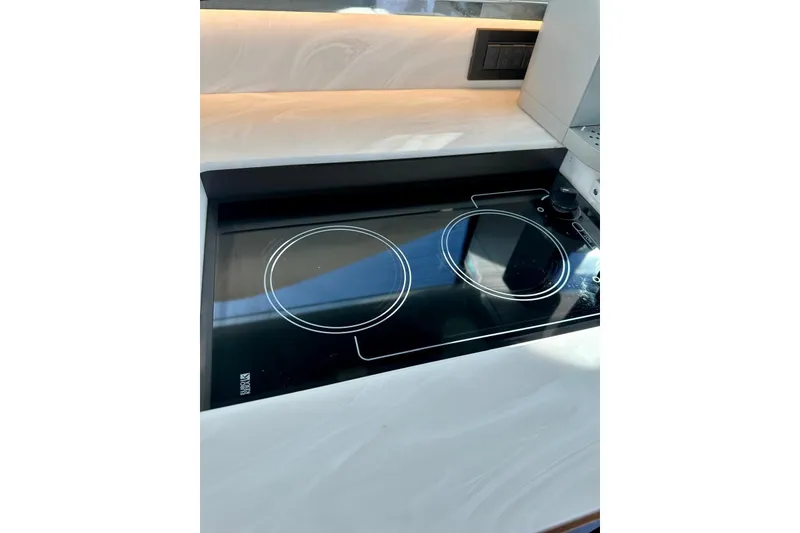 Slide: The Image of Modern stovetop in 2019 Tiara Yachts F44 Flybridge kitchen area. - 56