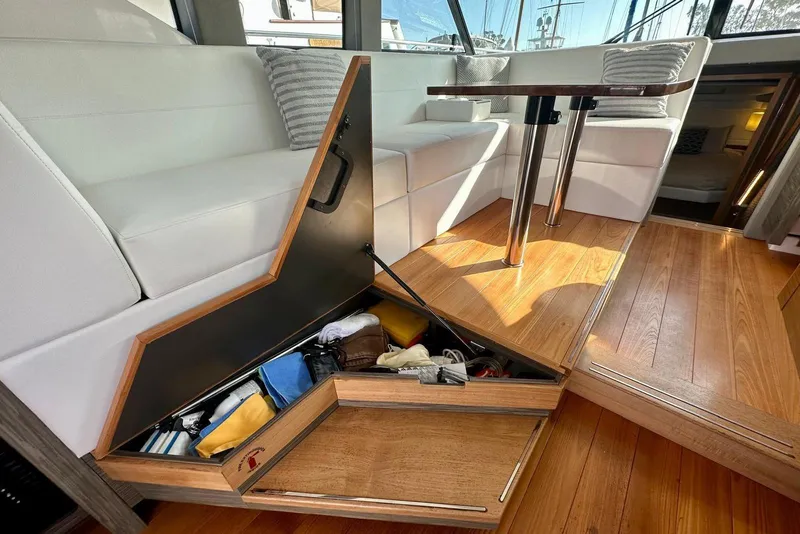 Slide: The Image of Luxurious 2019 Tiara Yachts F44 Flybridge interior with hidden storage under seating. - 57