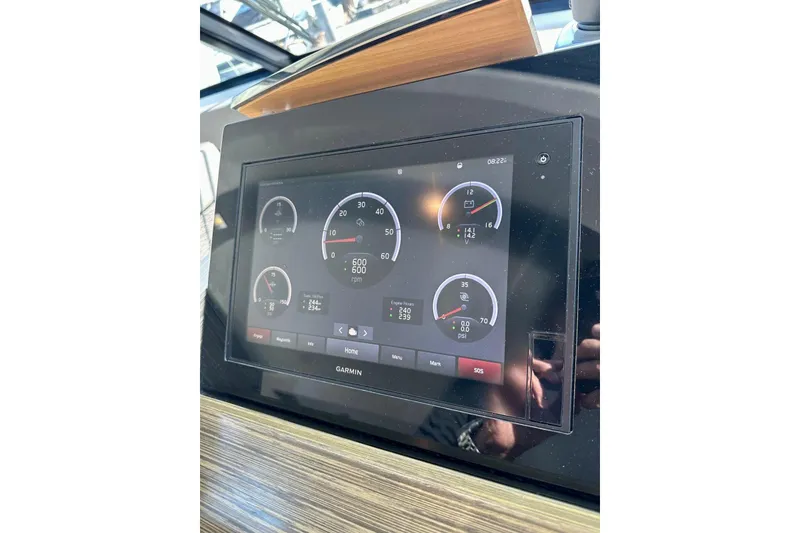 Slide: The Image of Dashboard display of a 2019 Tiara Yachts F44 Flybridge, featuring Garmin instrumentation. - 60