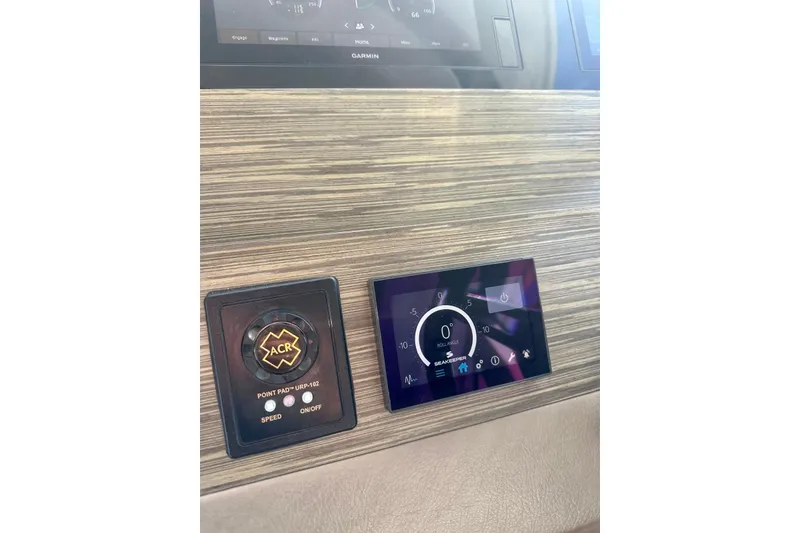 Slide: The Image of Control panel of a 2019 Tiara Yachts F44 Flybridge with ACR and Seakeeper displays. - 68