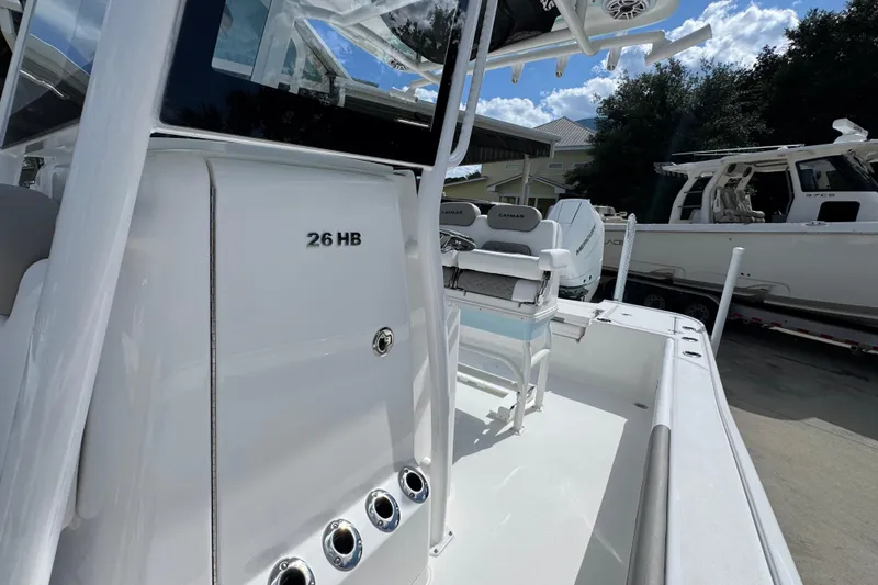 Slide: The Image of 2026 Caymas 26 HB boat with sleek white design and modern features. - 23