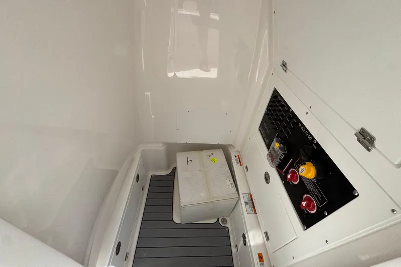 Slide: The Image of 2026 Caymas 26 HB interior compartment with control panel and storage box. - 25