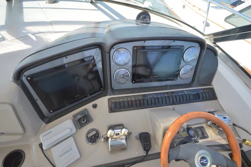 Slide: The Image of Control panel of a 2006 Sea Ray 40 Sundancer yacht with Garmin navigation systems. - 12