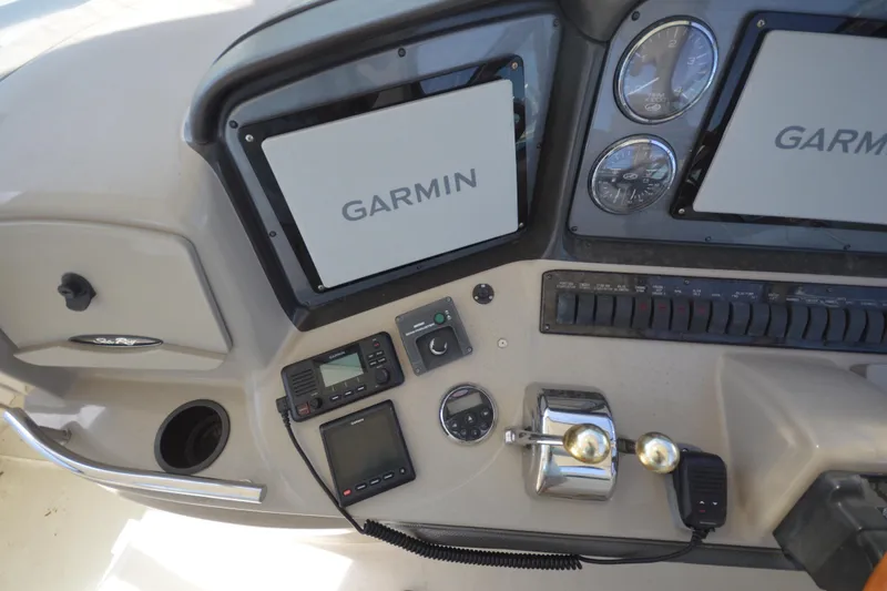 Slide: The Image of Control panel of a 2006 Sea Ray 40 Sundancer with Garmin navigation systems. - 13