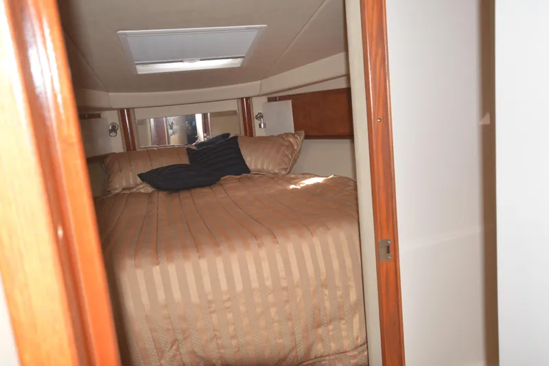 Slide: The Image of Luxurious cabin interior of 2006 Sea Ray 40 Sundancer yacht with cozy bedding. - 18