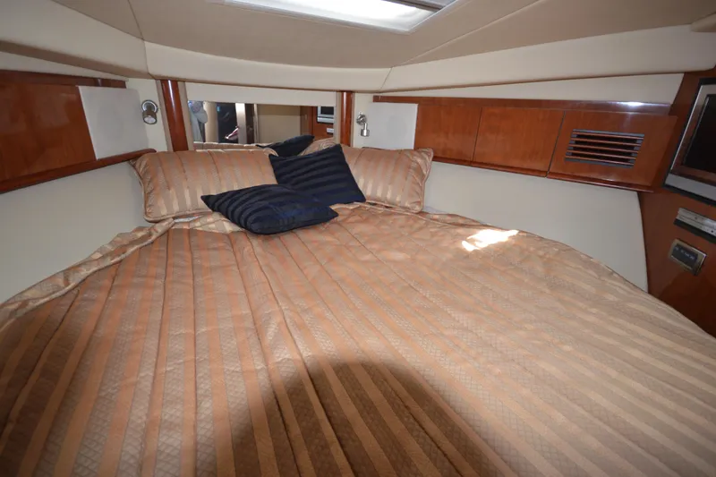 Slide: The Image of Luxurious cabin interior of 2006 Sea Ray 40 Sundancer yacht with cozy bedding. - 20