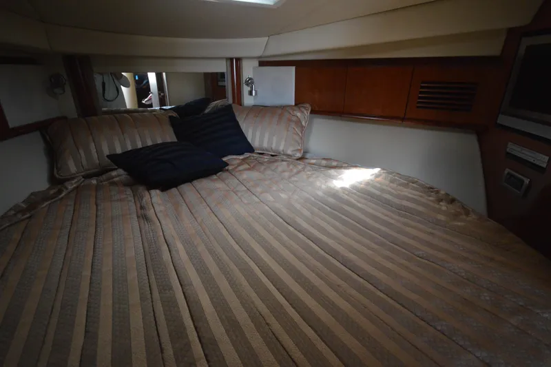 Slide: The Image of Luxurious cabin interior of 2006 Sea Ray 40 Sundancer yacht with cozy bedding. - 21