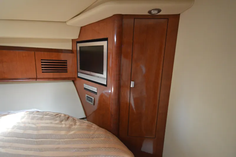 Slide: The Image of Interior of 2006 Sea Ray 40 Sundancer with wood paneling and built-in TV. - 22