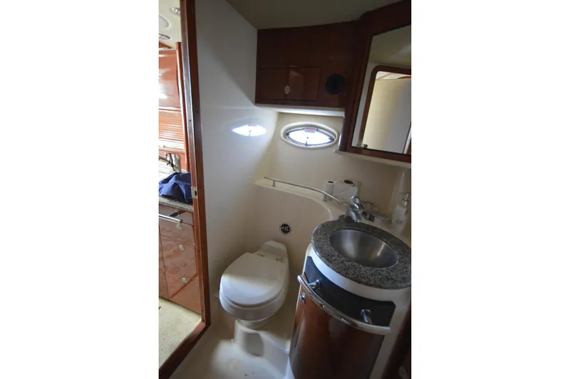 Slide: The Image of Bathroom interior of 2006 Sea Ray 40 Sundancer yacht with sink and toilet. - 23