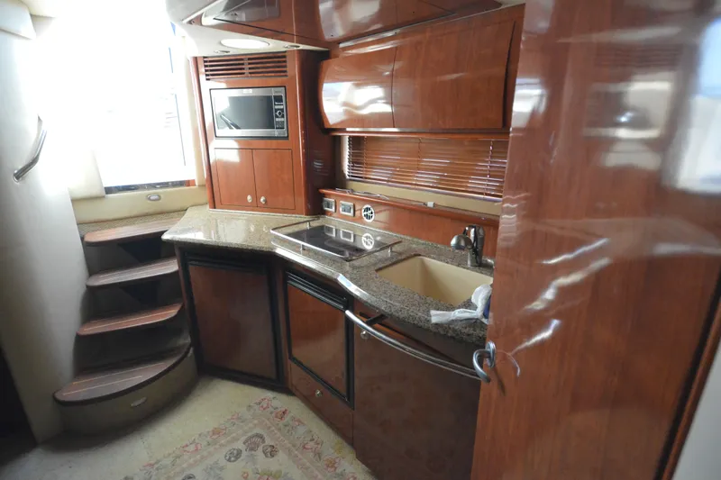 Slide: The Image of Luxurious 2006 Sea Ray 40 Sundancer yacht interior with modern kitchen amenities. - 24
