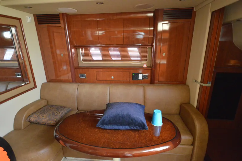 Slide: The Image of Luxurious interior of 2006 Sea Ray 40 Sundancer yacht with plush seating and wooden accents. - 26