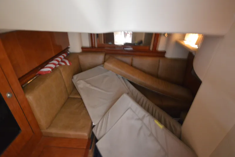 Slide: The Image of 2006 Sea Ray 40 Sundancer cabin interior with leather seating and cushions. - 27