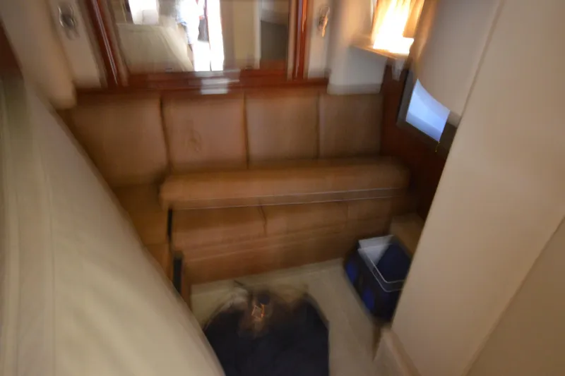 Slide: The Image of Blurry interior of 2006 Sea Ray 40 Sundancer yacht with leather seating and small TV. - 28