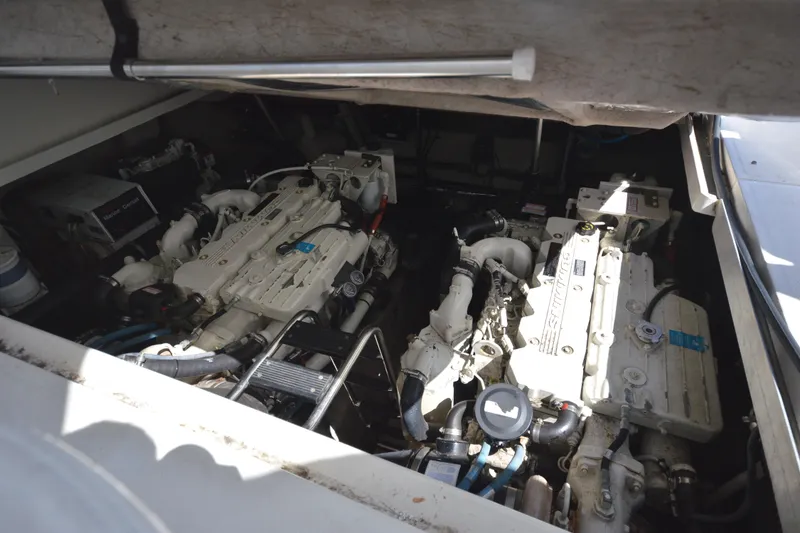 Slide: The Image of Engine compartment of a 2006 Sea Ray 40 Sundancer boat, showcasing dual engines. - 32